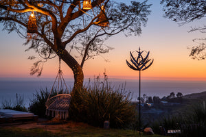 Tranquil evening windmills stand still in the setting sun's rays, giving a sense of calmness