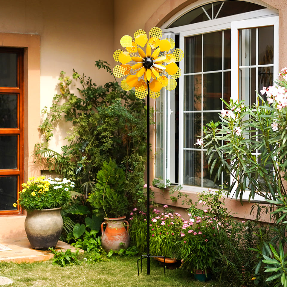 yard windmills spinners metal in yellow color like like a beautiful flower