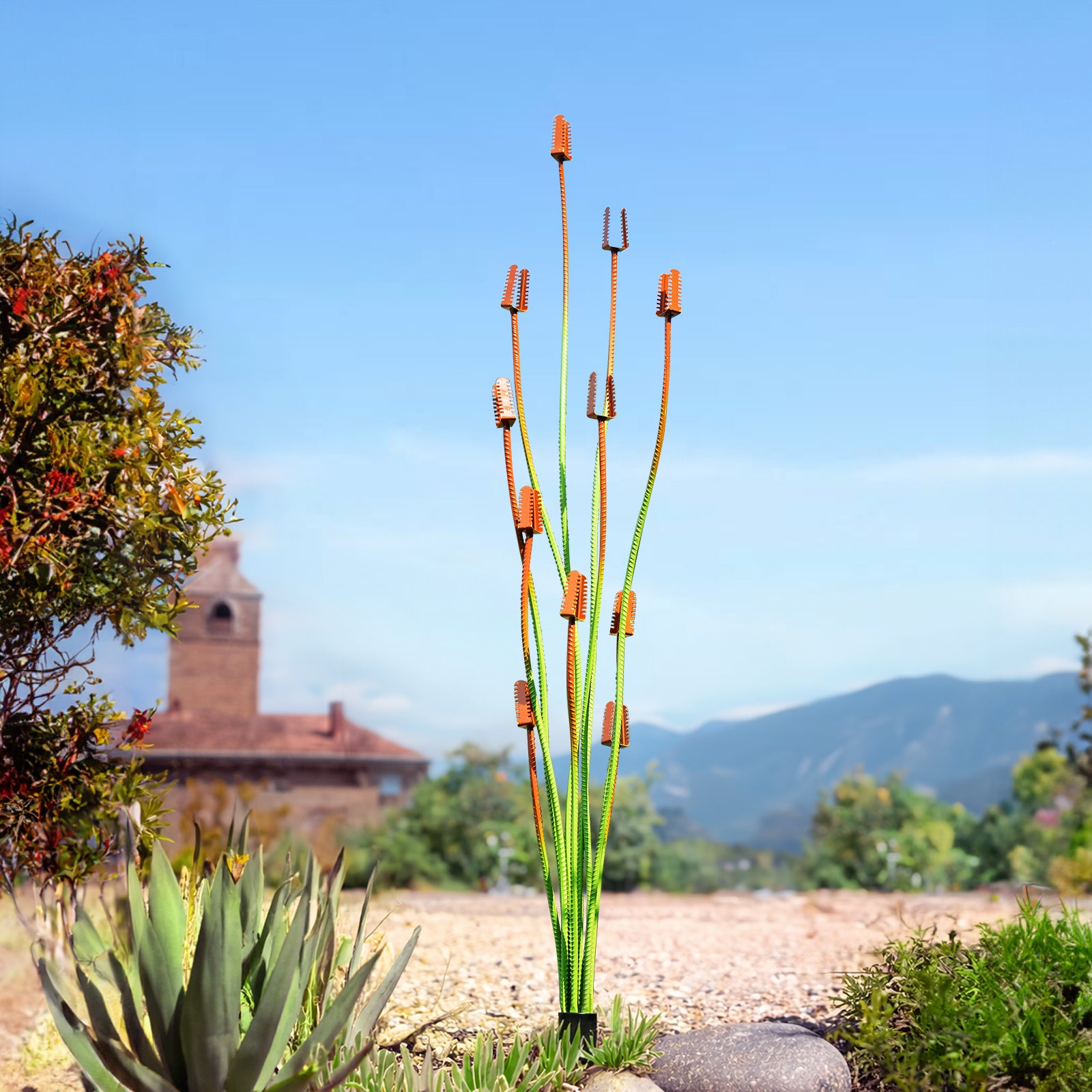 Decorative metal plant with a blurred landscape of trees and mountains in the background