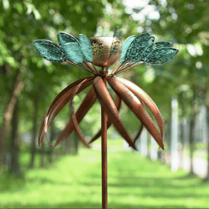 A windmill as graceful as a ballet skirt dances elegantly in the garden.